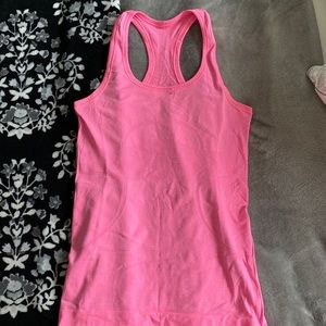 Lululemon tank top. Size 4. Pink. Never worn